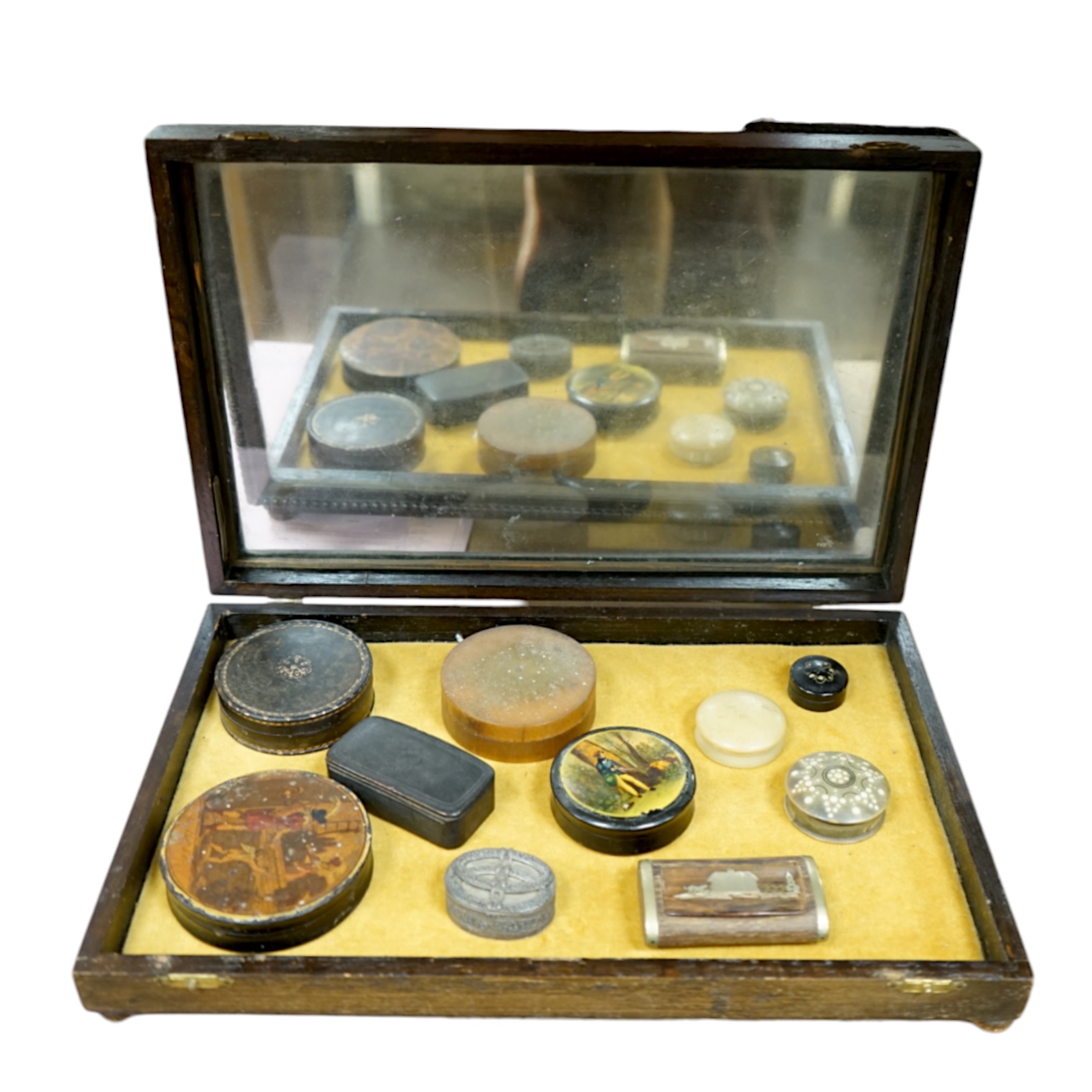 Ten various snuff boxes to include horn, white metal, brass mounted and one printed with a classical scene, 19th/20th century, largest 9cm in diameter. Condition - fair